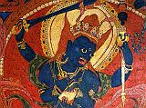 Tibet Guge 09 Tsaparang Demchog Temple 03 Blue Mahakala On the left side of the door is the four-armed Blue Mahakala (called Chandamaharoshana by Tucci), holding a sword and a vajra-topped curved chopper in his right hand, and a khatvanga (a staff with three human skulls, topped with a trident) and skull cup in his left. He is pot-bellied and stands on a human corpse. Photo - Weyer/Aschoff: Tsaparang, Tibets Grosses Geheimnis,
